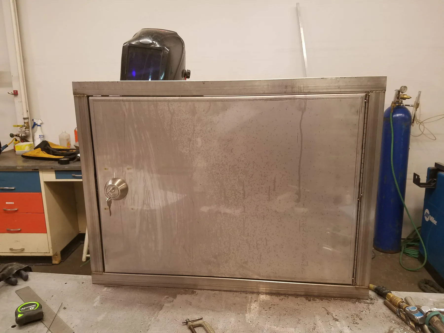 Fabricated stainless steel cabinet photographed in a workshop