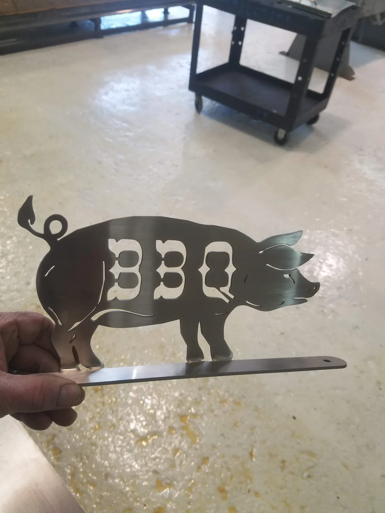Small custom metal pig-shaped barbecue sign