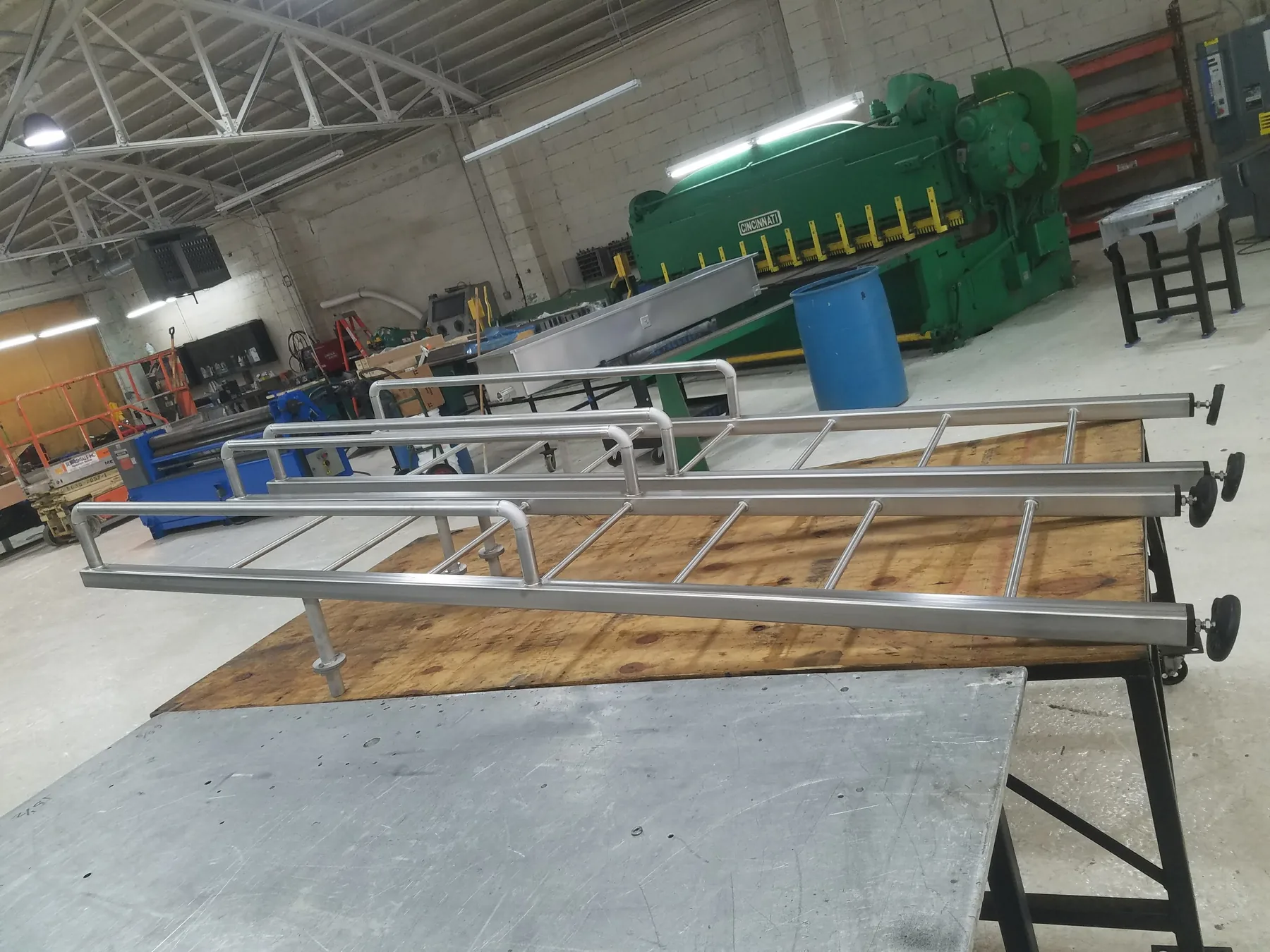 Long fabricated metal frame assembly in a workshop